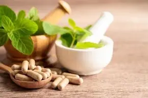 alternative medicine herbal organic capsule with vitamin e omega 3 fish oil mineral drug with herbs leaf natural supplements for healthy good life free photo